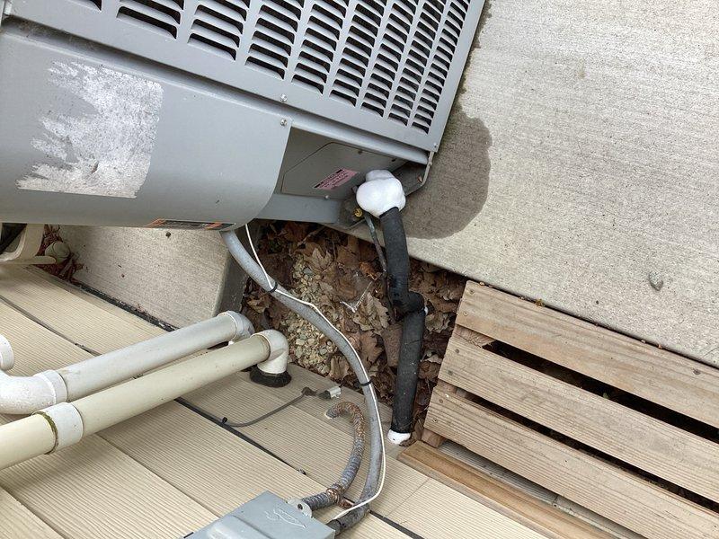 Responded to no cooling complaint on residential air conditioning system. Upon arrival, found evaporator coil completely frozen, preventing proper airflow and heat exchange. System was shut down to allow ice accumulation to thaw safely. Performed visual inspection of outdoor condensing unit and verified refrigerant line configuration. Documented equipment condition with photographs showing outdoor unit placement, refrigerant line routing, and overall system installation. Advised customer that frozen coil condition typically indicates underlying issues such as low refrigerant charge, restricted airflow, or failed metering device. Recommended scheduling follow-up appointment after complete thaw to conduct proper system diagnostics, check refrigerant levels, and provide repair estimate for identified deficiencies.