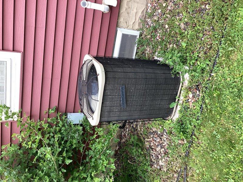 Responded to no cooling complaint on residential air conditioning system. Upon arrival, performed diagnostic evaluation of outdoor condensing unit. System inspection revealed low refrigerant charge as primary cause of cooling failure. Conducted pressure testing and identified refrigerant loss in aging system.

Given the unit's age of over 10 years and overall condition, recommended full system replacement rather than repair. Explained that the cost of locating and repairing refrigerant leak, combined with refrigerant recharge and potential for additional component failures in aging equipment, made replacement the most cost-effective long-term solution. Documented equipment condition with photographs showing outdoor condenser unit installation and system components. Customer advised of findings and replacement options.