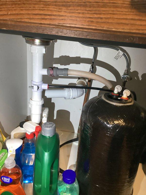 Responded to emergency call for kitchen drain leak. Upon arrival, inspected under-sink plumbing and identified failed drain assembly requiring immediate replacement. Removed deteriorated PVC drain components and installed new drain assembly with proper sealing and connections. Tested system for leaks and confirmed proper drainage function upon completion.