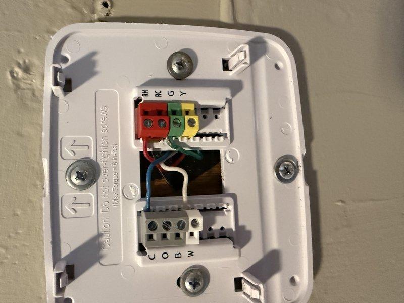 Responded to no cooling complaint on residential air conditioning system. Upon arrival, found thermostat improperly wired, preventing system operation and indoor fan from running. Corrected thermostat wiring connections at terminal block, restoring proper communication between thermostat and outdoor condensing unit. Verified system operation and confirmed cooling function restored.