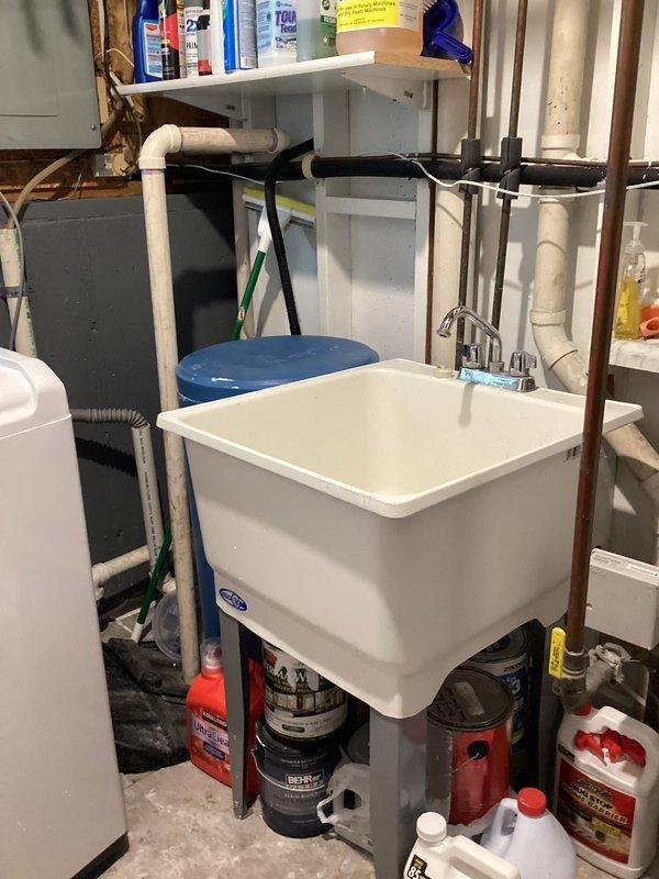 Arrived within scheduled 8-12 timeframe and conducted on-site evaluation of existing water treatment system in basement utility area. Assessed current single-tank water softener configuration and provided comprehensive estimate for upgrading to a two-piece water softener system with separate brine tank and resin tank for improved water conditioning capacity and efficiency.