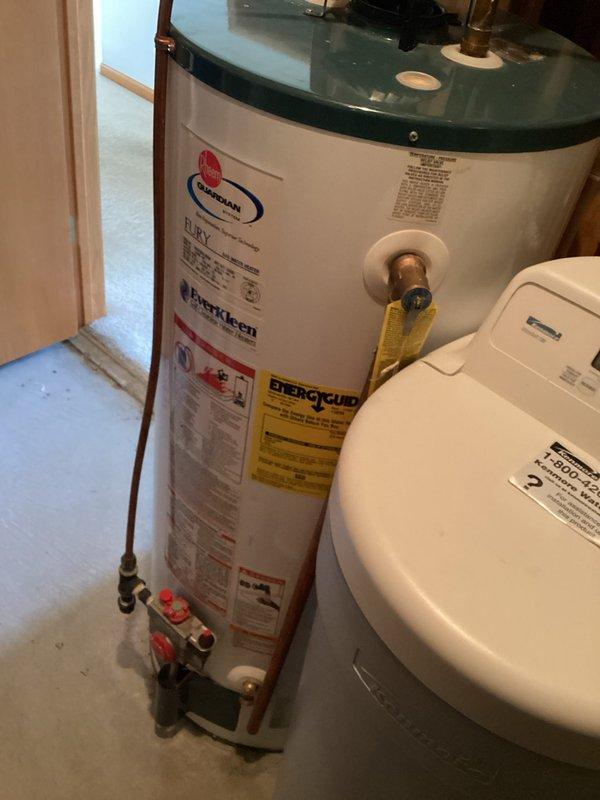 Responded to customer concern regarding water discoloration from tanked water heater system. Conducted comprehensive inspection of the water heater unit, including examination of tank condition, inlet and outlet connections, pressure relief valve, and all associated copper plumbing lines. Inspected for sediment buildup, corrosion, and potential contamination sources. After thorough evaluation, determined that the water heater and all connected components were functioning properly with no defects or issues identified that would cause water discoloration.