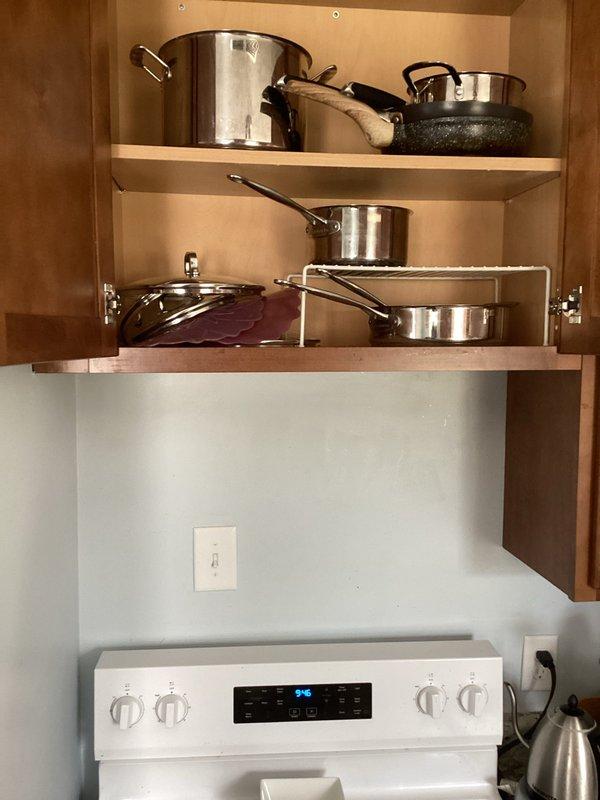 Installed a dedicated 20-amp circuit for an over-the-range microwave outlet in the kitchen. Accessed the electrical panel from an unfinished laundry/utility area and ran new wiring through the wall cavity to the location above the stove, terminating in a code-compliant receptacle for the microwave installation.