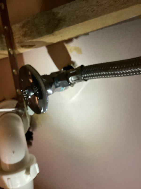 Responded to callback for recurring leak at shut-off valve compression nut connection to copper supply line. After multiple unsuccessful attempts to tighten the compression fitting by both technicians and homeowner, determined that complete valve replacement was necessary. Removed failed shut-off valve and installed new valve assembly with proper compression connection to existing copper pipe. Verified all connections were secure and tested system for leaks. Issue resolved.