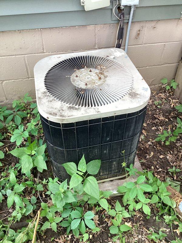 Responded to no cooling complaint on residential air conditioning system. Upon arrival, found outdoor condenser unit heavily soiled with debris accumulation on coil surfaces and top grille, restricting airflow and reducing heat transfer efficiency. Indoor air filter was severely clogged with dust and particulate matter, further impeding system performance. Replaced dirty 14x20x1 air filter with new unit. Advised customer that outdoor condenser requires professional coil cleaning and system would benefit from comprehensive preventive maintenance service to restore proper cooling capacity and efficiency.