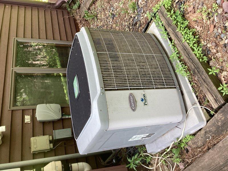 Responded to no cooling complaint on Carrier air conditioning system. Upon arrival, found outdoor condenser unit not starting automatically while indoor blower operated normally. Customer reported manually pressing contactor would start unit, and contactor had been recently replaced. Diagnosed faulty pressure switches preventing proper system operation. Bypassed defective pressure switches to restore cooling functionality. System tested and confirmed operational after repair.