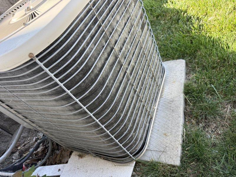 Responded to no cooling complaint on residential air conditioning system. Upon inspection, discovered burnt electrical wiring caused by severely clogged condenser coil restricting airflow and causing system overheating. Repaired damaged wiring and performed thorough condenser coil cleaning to restore proper airflow and system operation. Delivered furnace filter as requested and verified system cooling functionality upon completion.