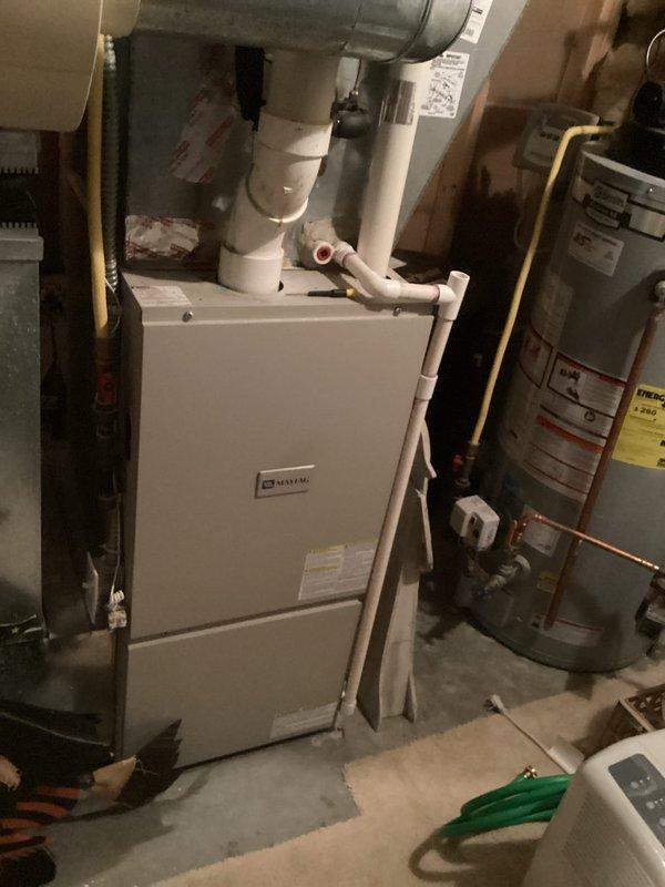 Completed comprehensive electrical inspection of residential property for FRM compliance. Inspected basement mechanical room electrical connections serving HVAC system, furnace, and water heater, verifying proper grounding and circuit protection. Evaluated main floor electrical installations including triple-gang switch configuration with integrated programmable thermostat control. All electrical systems, wiring, and components found to meet current code requirements with no deficiencies identified.