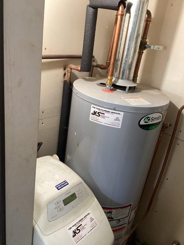 Responded to service call for leaking water heater. Upon arrival, confirmed active leak from existing A.O. Smith tanked water heater requiring immediate replacement. Removed failed unit and installed new A.O. Smith residential water heater with proper venting and code-compliant connections. Connected all copper supply lines, installed temperature and pressure relief valve with discharge piping, and integrated system with existing water softener. Tested all connections for leaks, verified proper operation, and ensured system was functioning correctly before departure.