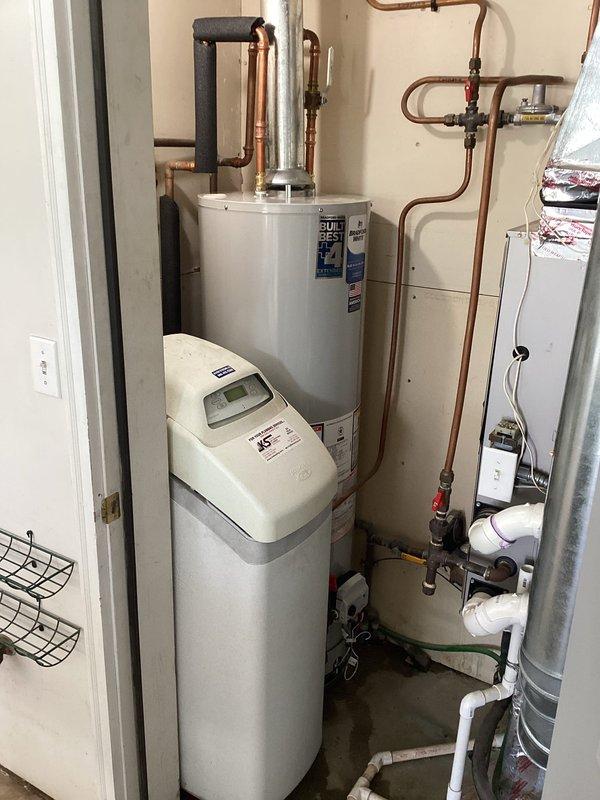 Responded to service call for leaking water heater. Upon arrival, confirmed active leak from existing A.O. Smith tanked water heater requiring immediate replacement. Removed failed unit and installed new A.O. Smith residential water heater with proper venting and code-compliant connections. Connected all copper supply lines, installed temperature and pressure relief valve with discharge piping, and integrated system with existing water softener. Tested all connections for leaks, verified proper operation, and ensured system was functioning correctly before departure.
