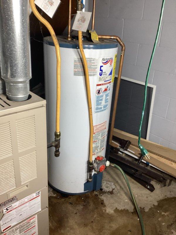 Responded to no cooling complaint on air conditioning system. Upon arrival, found tripped breaker at electrical panel. Reset breaker and verified system operation - air handler running properly with adequate airflow, condenser unit operating within normal parameters. Conducted system diagnostics and found no electrical faults or operational issues causing the breaker trip. System restored to normal cooling operation.

During inspection of mechanical room, observed active water leak from storage tank on gas water heater. Documented condition with photographs and provided estimate for water heater replacement due to tank failure.