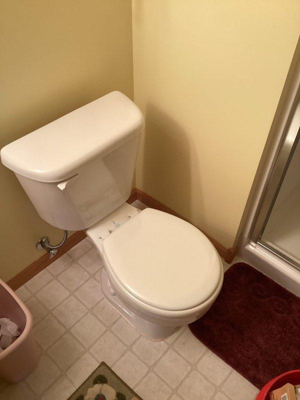 Responded to service call for two toilet malfunctions in residential bathroom. Primary issue involved toilet continuously running after flush cycle completion. Secondary issue concerned inadequate water refill in bowl after flushing. 

Upon inspection, identified failed fill valve and deteriorated flapper as root causes. Tank interior exhibited significant water discoloration and mineral sediment buildup, indicating hard water conditions and component degradation. Fill valve assembly showed wear on float mechanism affecting proper shutoff function. Rubber flapper valve demonstrated loss of seal integrity, preventing complete closure and causing constant water flow into bowl.

Performed complete toilet rebuild, replacing fill valve assembly and flapper valve with new components. Restored proper flush and refill operation to both fixtures. System tested and verified functional upon completion.