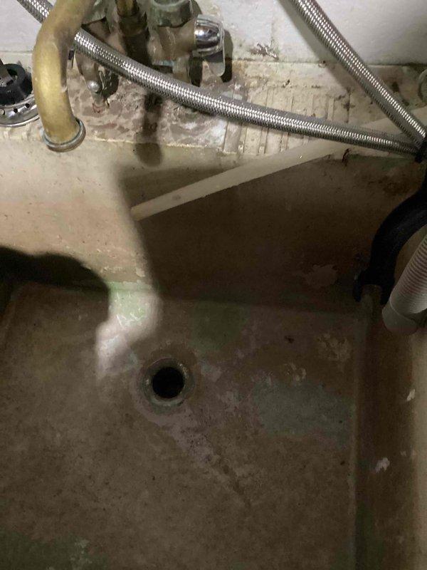 Responded to a clogged drain service call and found the laundry drain backing up into the utility sink in the mechanical room. Upon inspection, identified heavy grease buildup in the cast iron drain line causing the blockage. Deployed cable machine and ran 39 feet into the drain line to clear the obstruction. Successfully opened the drain to restore partial flow; however, significant grease accumulation remains in the line. Advised that hydro jetting service will be required to fully remove all grease deposits and restore optimal drainage performance in the cast iron piping system.