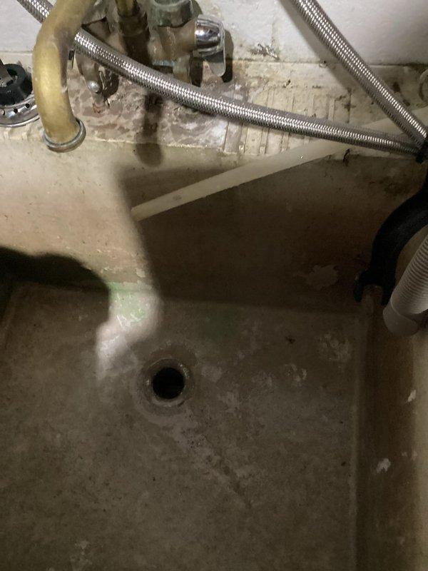 Responded to a clogged drain service call and found the laundry drain backing up into the utility sink in the mechanical room. Upon inspection, identified heavy grease buildup in the cast iron drain line causing the blockage. Deployed cable machine and ran 39 feet into the drain line to clear the obstruction. Successfully opened the drain to restore partial flow; however, significant grease accumulation remains in the line. Advised that hydro jetting service will be required to fully remove all grease deposits and restore optimal drainage performance in the cast iron piping system.