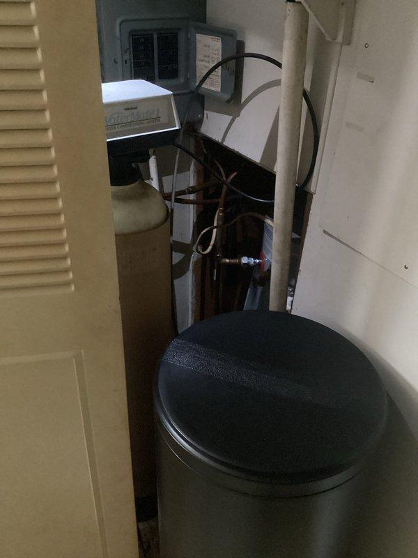 Responded to service call for leaking water heater. Upon arrival, confirmed active leak from tanked water heater requiring immediate replacement. Removed existing failed unit and installed new tanked water heater. Connected all necessary water supply lines, pressure relief valve, and drain pan. Verified proper venting, tested all connections for leaks, and confirmed unit operational. Also observed water filtration system with dual canister filters installed under sink during inspection of plumbing connections.