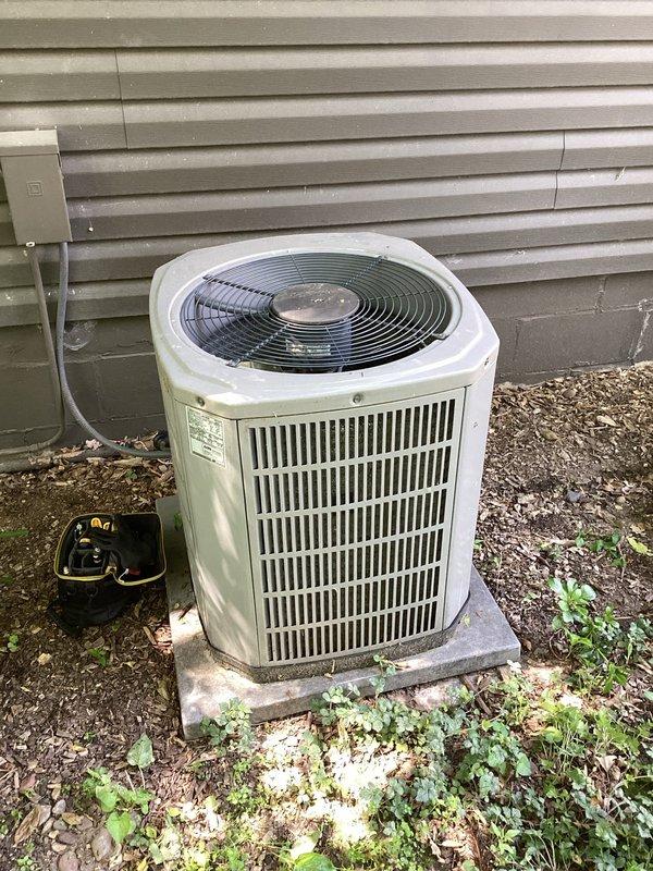 Responded to service call for American Standard air conditioning system experiencing loud hammering noise at condenser unit. Upon arrival, observed system cycling on and off intermittently. Diagnostic testing revealed unit was cutting out on low pressure switch and restarting once refrigerant pressure recovered, indicating active refrigerant leak in system. Given the age of the equipment (manufactured 2019) and severity of refrigerant loss, recommended customer consider system replacement versus leak detection and repair with refrigerant recharge. Customer advised of options and associated considerations for each approach.