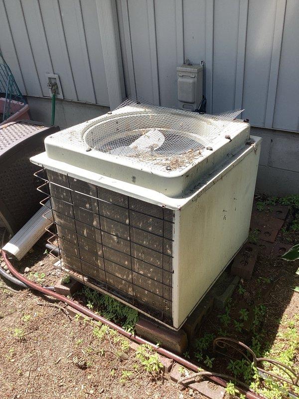 Responded to no cooling complaint on aging outdoor condensing unit. Upon arrival, diagnosed failed compressor causing circuit breaker to trip repeatedly. Unit showed significant age-related wear and deterioration. Provided estimate for compressor replacement and discussed repair options with property owner.