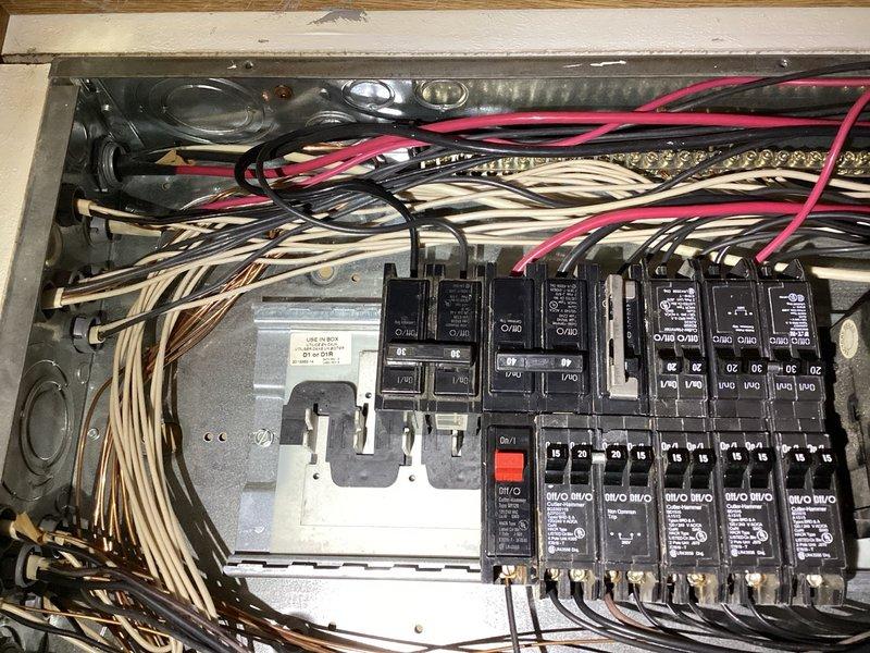 Responded to no cooling complaint at mobile home location. Upon arrival, confirmed air conditioning system was completely inoperative. Performed diagnostic evaluation and traced issue to failed circuit breaker in main electrical panel serving the outdoor condensing unit. Breaker would not reset and showed signs of failure. Advised customer that electrical repairs fall outside scope of HVAC service and recommended scheduling licensed electrician to replace defective breaker before system can be restored to operation.