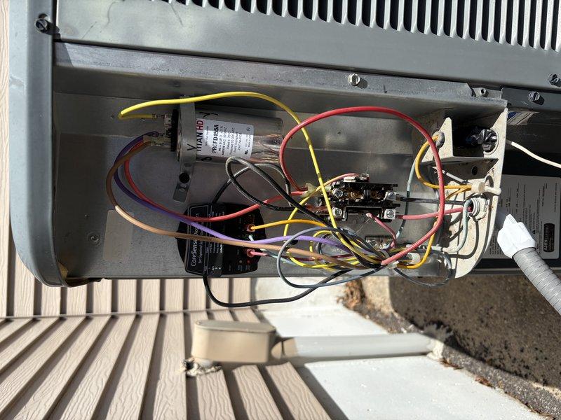 Responded to no cooling complaint on residential air conditioning system. Upon inspection, discovered 24-volt control wire had disconnected from wire nut in electrical compartment. Reconnected and secured wire, restoring proper electrical connection. Performed complete system maintenance and verified unit returned to normal cooling operation.