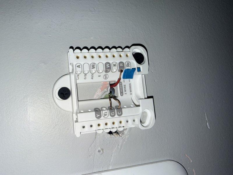 Responded to no cooling complaint on residential air conditioning system. Upon arrival, found system not providing cool air despite fan operation. Inspection revealed thermostat wiring was incorrectly connected at terminal block. Corrected all wire connections to proper terminals per manufacturer specifications. Verified system operation and restored cooling functionality.
