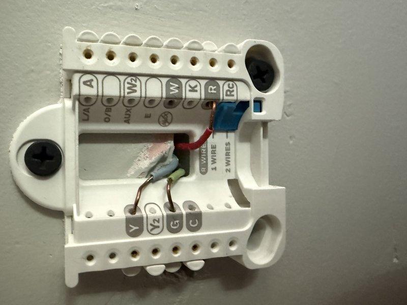 Responded to no cooling complaint on residential air conditioning system. Upon arrival, found system not providing cool air despite fan operation. Inspection revealed thermostat wiring was incorrectly connected at terminal block. Corrected all wire connections to proper terminals per manufacturer specifications. Verified system operation and restored cooling functionality.