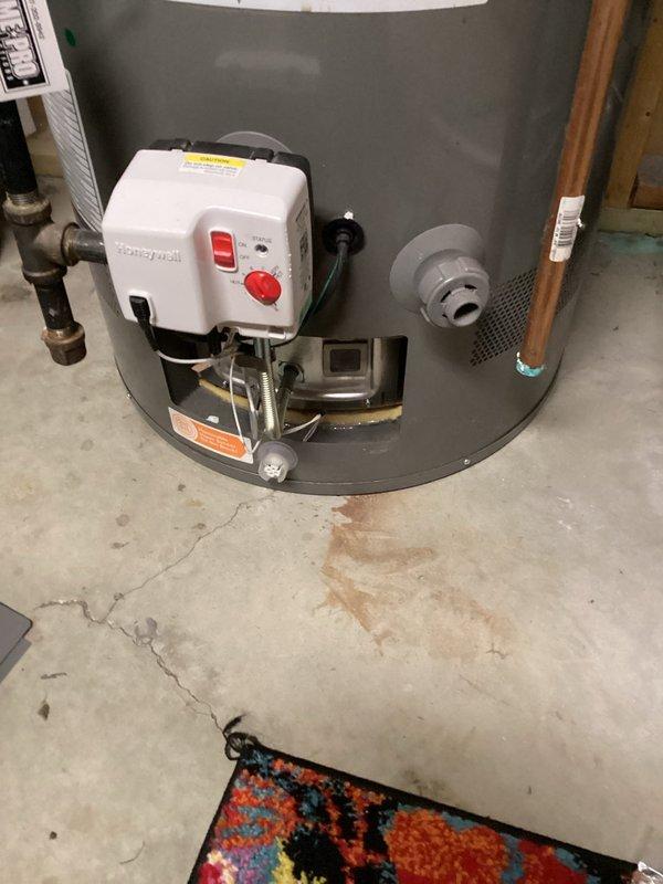 Responded to no hot water complaint and diagnosed water heater failure to ignite. Identified defective flammable vapor sensor preventing gas valve operation. Removed faulty sensor from Honeywell gas control valve and installed replacement sensor. Performed factory reset procedure on gas control valve, successfully ignited pilot light, and verified proper burner operation and hot water production.