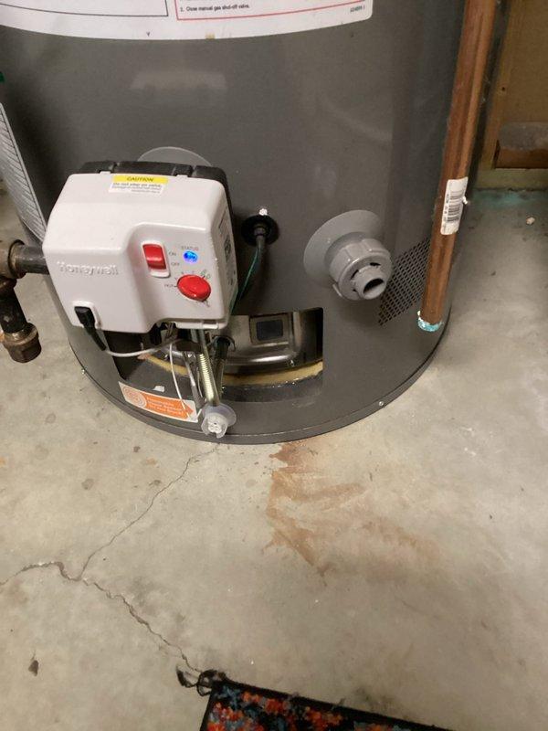 Responded to no hot water complaint and diagnosed water heater failure to ignite. Identified defective flammable vapor sensor preventing gas valve operation. Removed faulty sensor from Honeywell gas control valve and installed replacement sensor. Performed factory reset procedure on gas control valve, successfully ignited pilot light, and verified proper burner operation and hot water production.