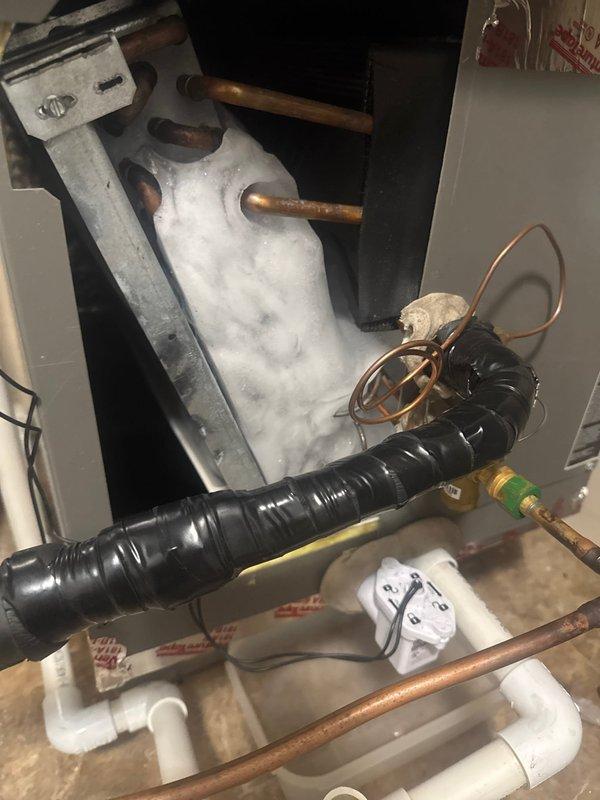 Responded to no cooling complaint and found frozen evaporator coil caused by severely restricted airflow from dirty furnace filter. Replaced filter, thawed coil using furnace heat at customer's request due to downflow configuration, and verified system pressures and proper operation after defrost cycle completed.
