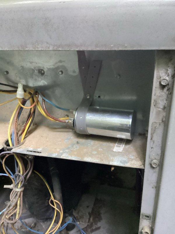 Responded to no cooling complaint on residential air conditioning system. Upon inspection, diagnosed failed capacitor preventing compressor operation. Replaced defective capacitor and restored system to normal cooling operation.