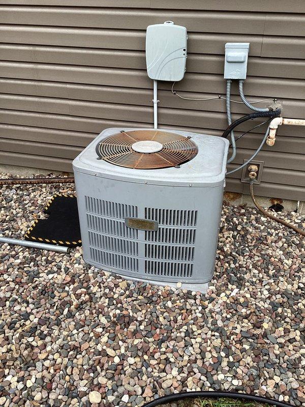 Responded to no cooling complaint on 25+ year old residential air conditioning system. Upon arrival, confirmed unit was blowing warm air with no cooling capability. Diagnostic testing revealed a failed 30-amp double-pole circuit breaker supplying power to the outdoor condenser unit. Breaker would not reset and showed signs of internal failure. Replaced defective breaker with new 30-amp double-pole circuit breaker, restored power to system, and verified proper operation of condenser unit with normal fan operation and compressor engagement.