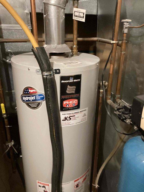 Responded to outdoor faucet leak and discovered burst hose bibb with leaking pipe. Accessed plumbing through interior wall opening, removed failed hose bibb assembly, and installed new replacement unit with proper fittings. Restored water supply to home and verified system operated without leaks upon completion.