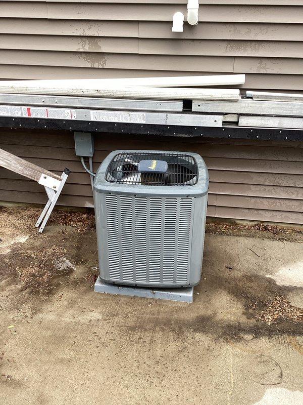 Responded to no cooling call on residential AC unit over 10 years old. System was completely non-operational with no power to unit and thermostat unable to communicate with equipment. Upon inspection, identified loose low voltage wiring connection at equipment. Secured low voltage connection and restored power to system, returning unit to normal operation with proper cooling function.