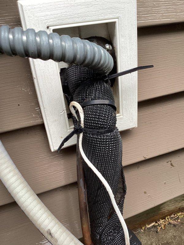 Responded to no cooling call on residential AC unit over 10 years old. System was completely non-operational with no power to unit and thermostat unable to communicate with equipment. Upon inspection, identified loose low voltage wiring connection at equipment. Secured low voltage connection and restored power to system, returning unit to normal operation with proper cooling function.