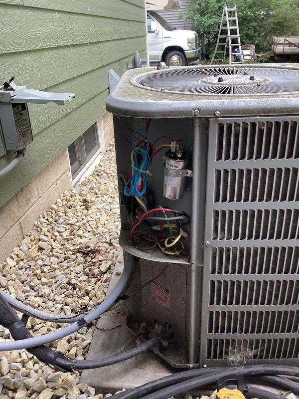 Responded to no cooling complaint at residential property. Upon arrival, performed diagnostic evaluation of outdoor condensing unit. Testing confirmed failed capacitor preventing compressor operation. Removed defective capacitor, installed replacement component, and verified proper system operation with normal cooling restored.