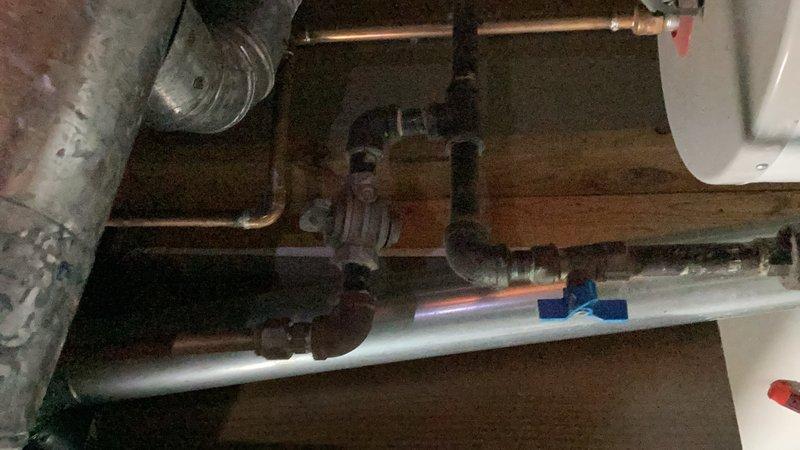 Responded to service call for non-operational furnace with compromised vent stack. Upon inspection, discovered the top of the vent stack had rusted completely through and detached from the roof penetration. Temporarily secured the damaged vent cap using sheet metal screws to restore safe operation. Coordinated preparation of replacement quote for complete vent stack system due to extent of corrosion damage.