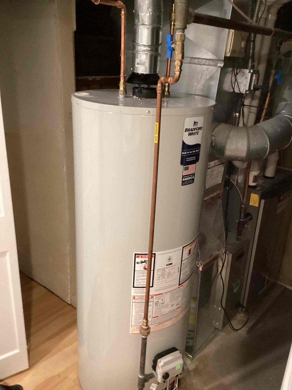 Responded to callback for non-functioning Bradford White water heater. Upon inspection, assessed existing 40-gallon propane unit and determined replacement necessary. Provided estimate for new 40-gallon power vent propane water heater installation, documented existing equipment configuration including copper supply lines, gas control valve assembly, and power vent connections for replacement specifications.
