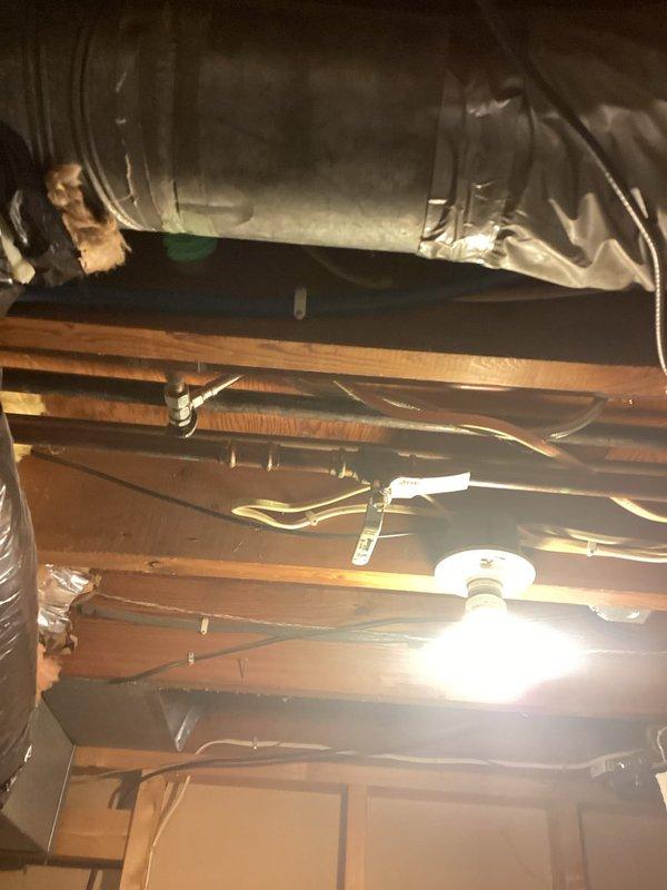 Responded to service call for leaking exterior hose bib. Upon arrival, confirmed active leak at outdoor water spigot mounted on exterior wall. Accessed plumbing connections from attic crawl space to isolate water supply. Removed failed hose bib fixture and installed new replacement unit, ensuring proper seal at wall penetration. Tested system for leaks and verified proper operation of new hose bib.