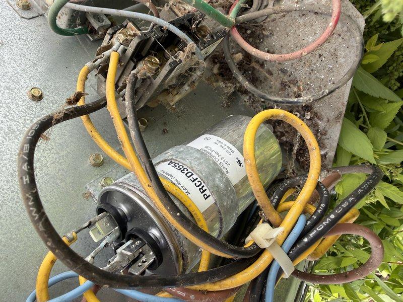 Responded to no cooling condition affecting entire residence. Diagnosed failed compressor capacitor on outdoor condensing unit. Removed defective capacitor and installed replacement component, restoring system to proper operation.
