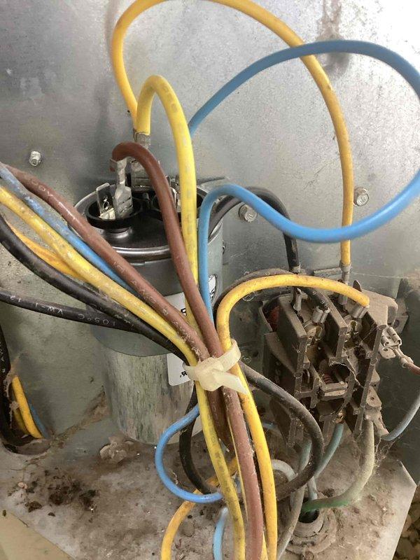 Responded to no cooling complaint on 10+ year old air conditioning system. Upon arrival, found unit running but not producing cool air. Diagnostics revealed system was low on refrigerant and had a failed capacitor. Replaced defective capacitor and restored proper system operation.