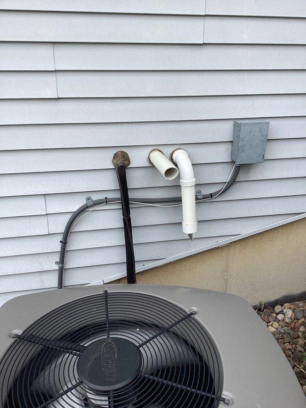 Responded to no cooling call on residential HVAC system. Upon arrival, found thermostat unable to connect to WiFi following power outage, preventing AC operation. Diagnosed low voltage short in control wiring. Replaced faulty AC wire to restore proper system operation and thermostat functionality.