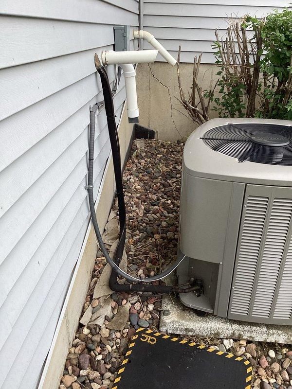 Responded to no cooling call on residential HVAC system. Upon arrival, found thermostat unable to connect to WiFi following power outage, preventing AC operation. Diagnosed low voltage short in control wiring. Replaced faulty AC wire to restore proper system operation and thermostat functionality.