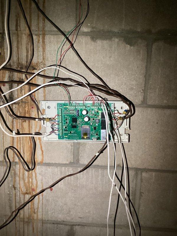 Responded to no cooling call on system with zone control. Upon arrival, diagnosed communication failure between air conditioning unit and zone control board. Zone control panel mounted on basement wall showed no communication with HVAC system, preventing proper operation. Ordered replacement zone control module to restore system functionality.