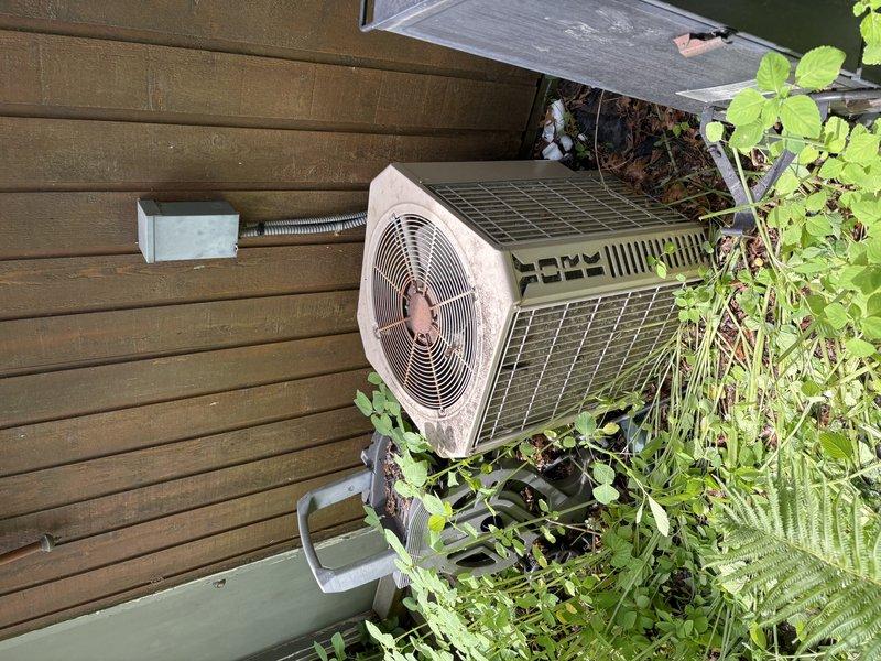 Responded to no cooling complaint and diagnosed system low on refrigerant. Upon inspection, determined the air conditioning system had a significant refrigerant leak that made repair uneconomical. Recommended and completed full system replacement, including outdoor condenser unit and indoor air handler, restoring proper cooling operation to the residence.