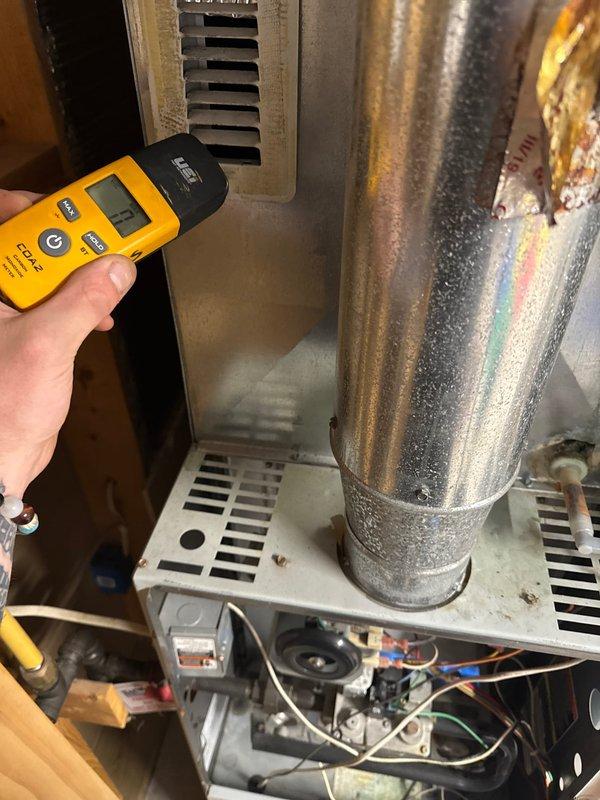 Responded to service call for suspected humidifier leak near furnace. Upon inspection, identified source as cracked evaporator drain pan causing water leakage. Used moisture detection equipment to confirm location and extent of water intrusion. Documented condensation present on supply ductwork and assessed overall HVAC system condition. Discussed findings and repair options with customer, who will schedule preventive maintenance service to address the cracked drain pan issue.