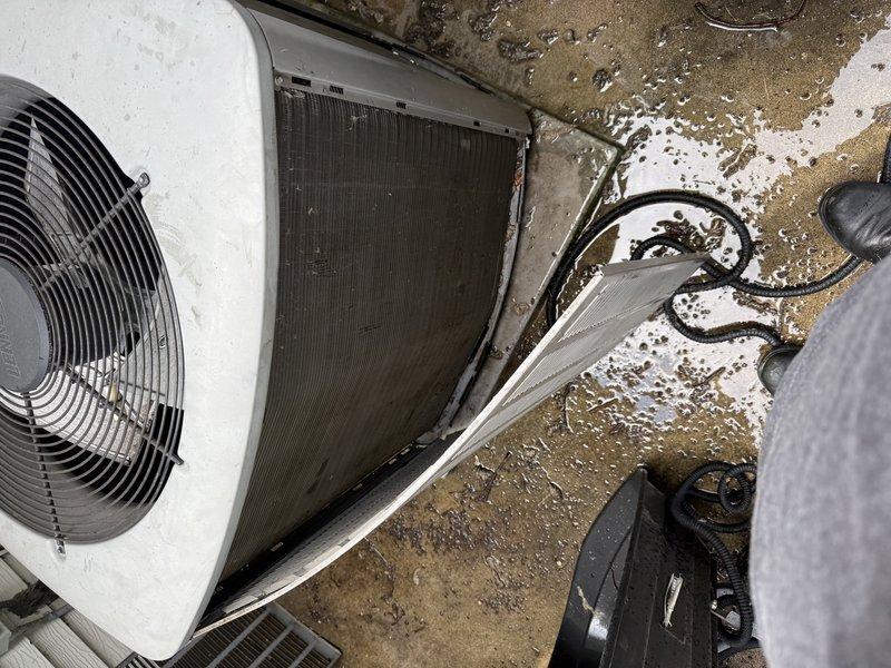 Responded to no cooling complaint with system icing up. Upon arrival, found extremely dirty air filter and heavily clogged condenser coil restricting airflow and causing freeze-up conditions. Cleaned condenser coil thoroughly to restore proper heat exchange and system operation.