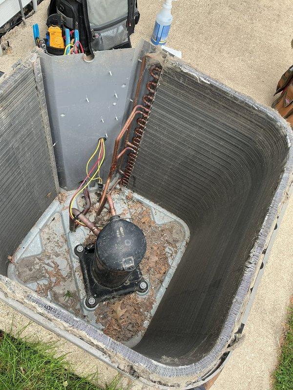Responded to AC leak check service call. Upon inspection, identified refrigerant leak at the metering device. Tightened the collar connection and performed retest to confirm leak was successfully sealed and system integrity restored.