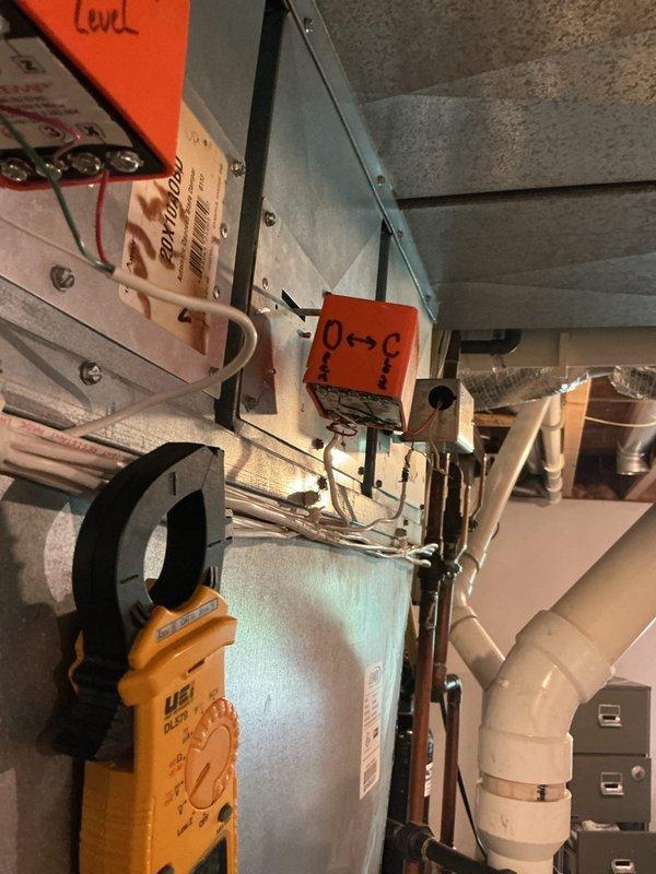 Responded to service call for suspected stuck-open damper on zoned HVAC system. Upon inspection, diagnosed failed zone damper with two additional dampers also found to be in deteriorated condition. Replaced one Honeywell zone damper, verified proper operation using diagnostic testing equipment, and scheduled follow-up appointment for replacement of the remaining two compromised zone dampers to restore full system functionality.