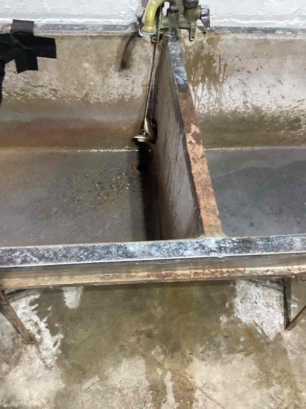 Responded to a clogged utility sink drain in the basement that receives discharge from both the washing machine and water softener. Attempted to clear the blockage by running a drain cable 25 feet into the line, but the obstruction persisted beyond the reach of standard equipment. Due to the severity and location of the blockage, referred the customer to a specialized drain cleaning service for advanced clearing techniques and equipment capable of addressing the deeper obstruction.