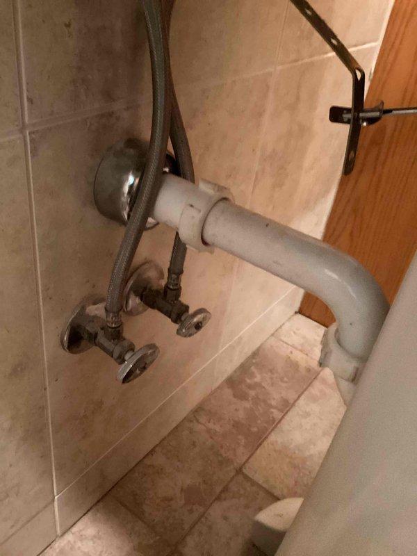 Responded to a backed-up lavatory faucet drain in a hallway bathroom with a pedestal sink configuration. Disassembled the trap assembly and ran a sink machine 25 feet into the drain line, successfully extracting a large wad of hair causing the blockage. Reassembled the drain assembly and tested the system by running the faucet for 3 minutes to confirm proper drainage with no further backup issues.