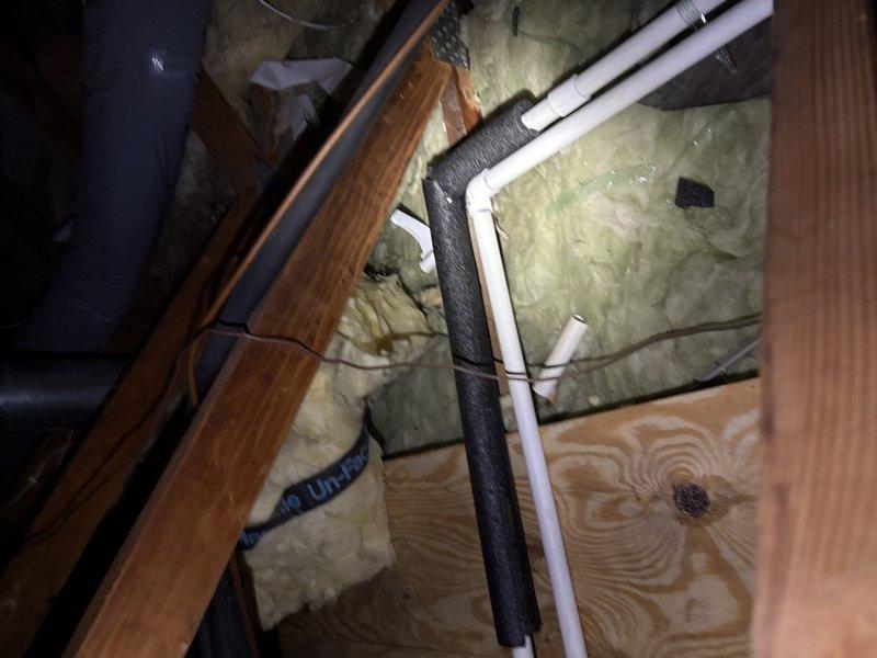 Responded to service call for water leaking from AC supply vent. Upon inspection, identified cracked condensate drain line in attic space, likely caused by freezing conditions. Removed and replaced damaged section of PVC drain pipe with new piping. Recommended scheduling preventative maintenance in fall to vacuum and clear condensate drain line system to prevent future blockages and potential freeze damage.